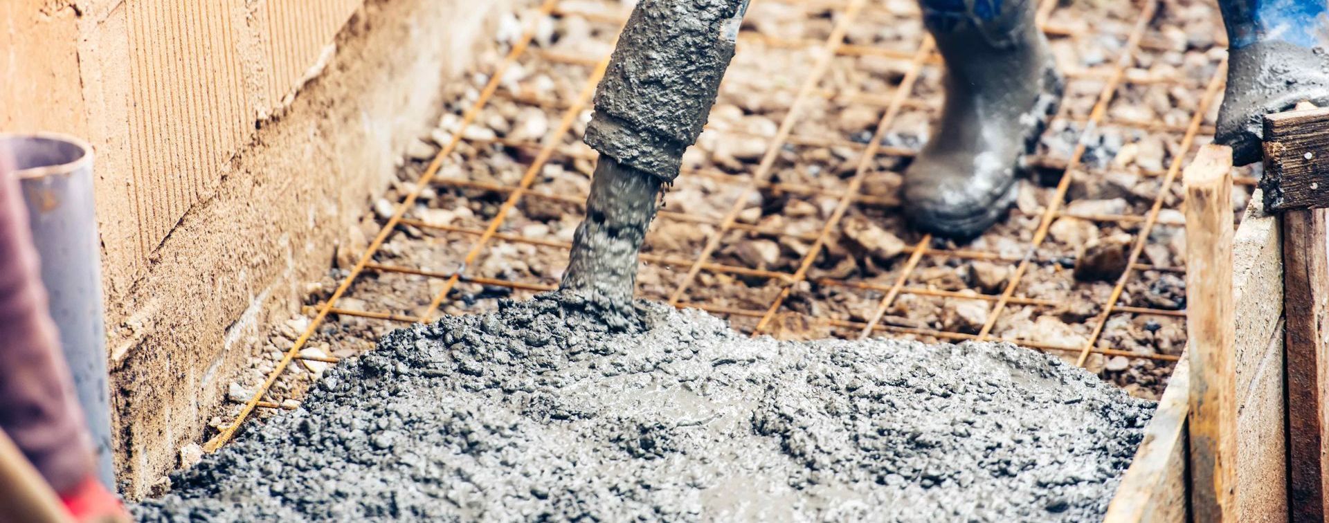 Professional Concrete Worker Pouring Concrete For Sidewalk