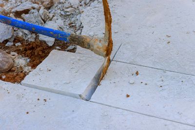 Removing Broken Pieces of Concrete For Concrete Slab Repair