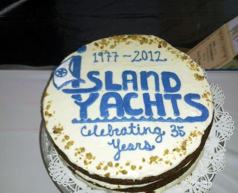 A cake that says island yachts celebrating 35 years