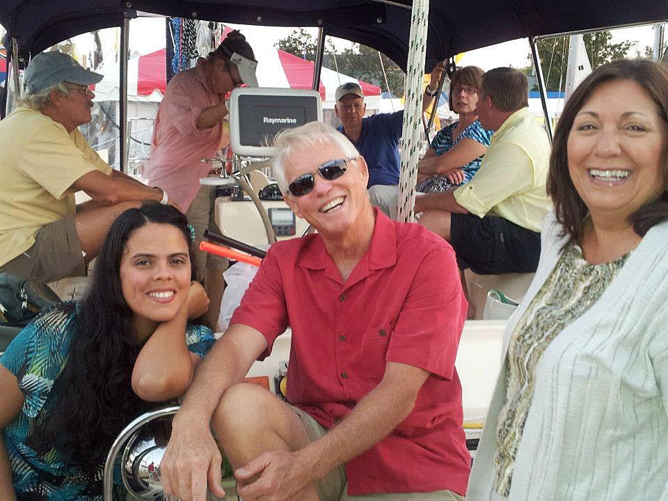 A group of people are posing for a picture on a boat