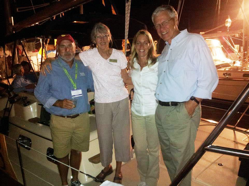 A group of people posing for a picture on a boat