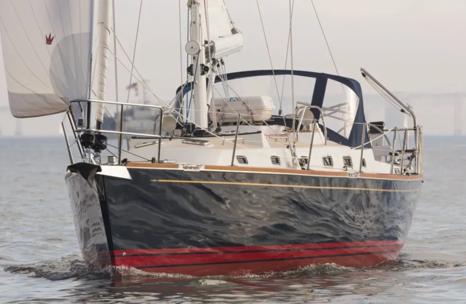 Yacht sailing in smooth seas on overcast day