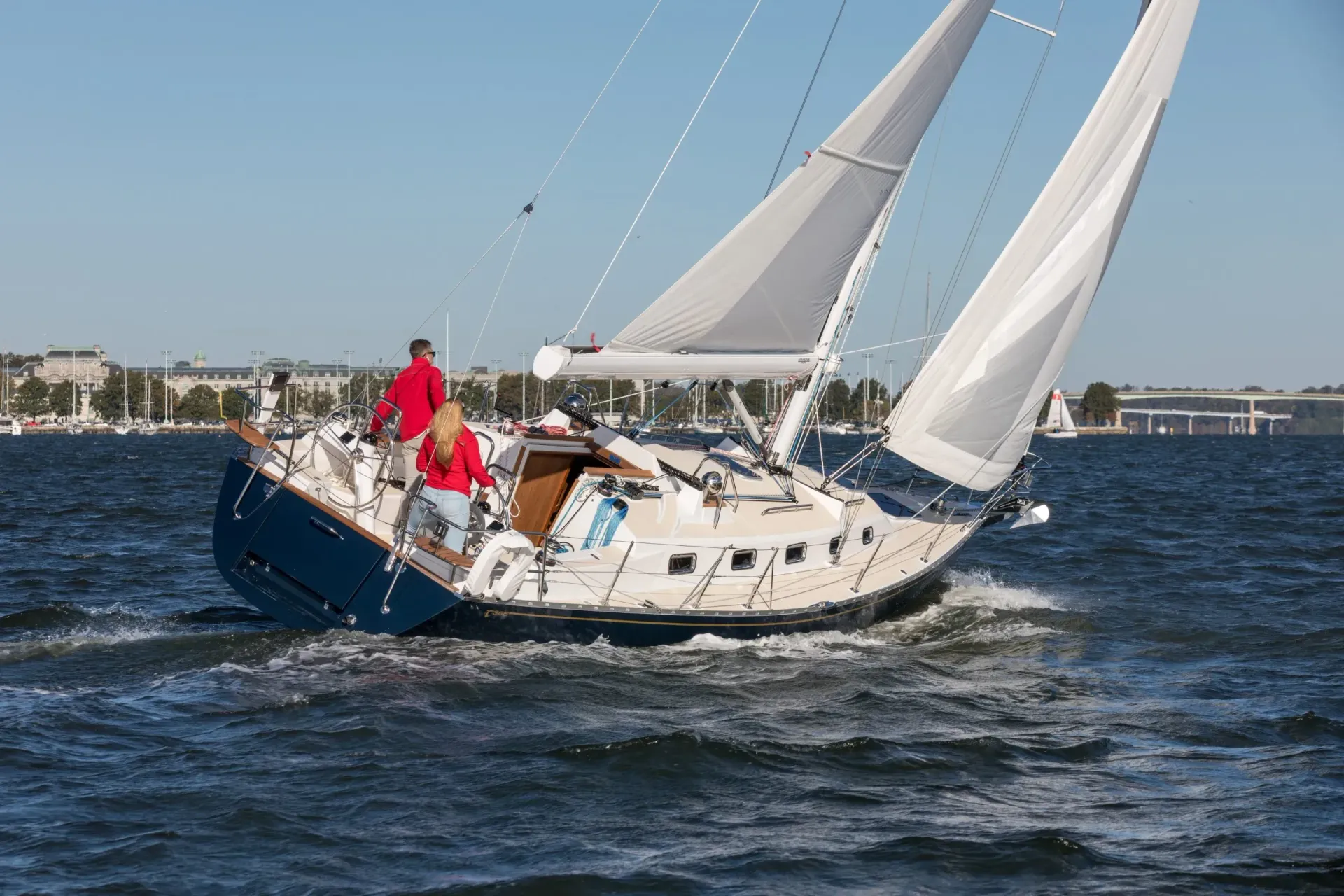 A sailboat is floating on top of a body of water.