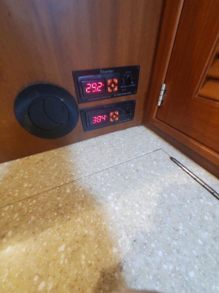 A couple of digital displays on a wall with the numbers 292 and 38 on them