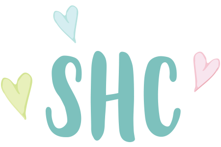 The word shc is surrounded by hearts on a white background.