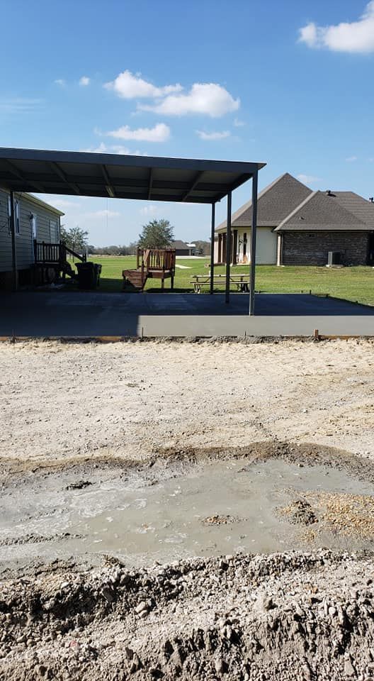 A carport is being built in the backyard of a house.