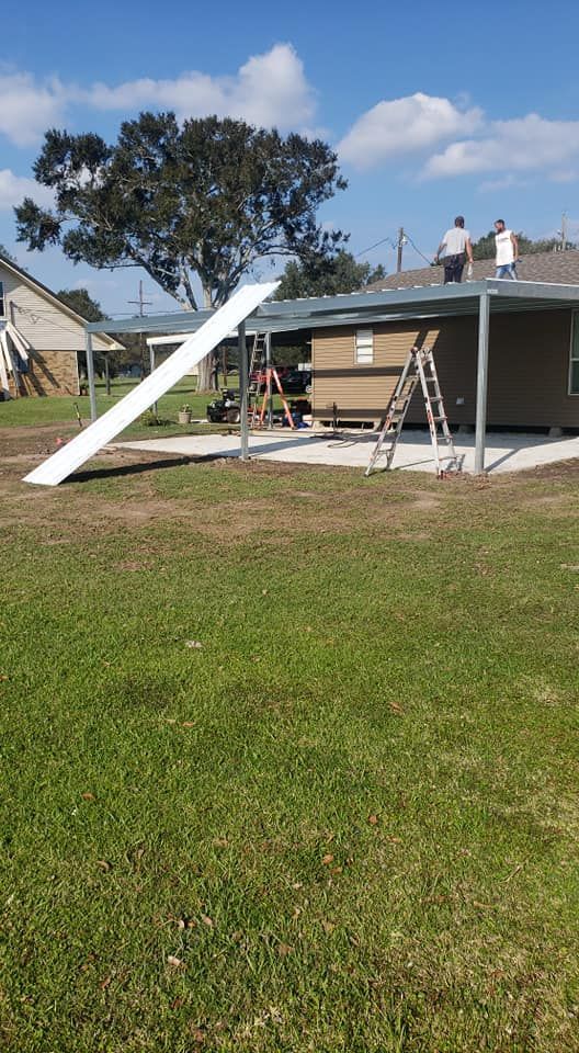 A group of people are working on the roof of a house.
