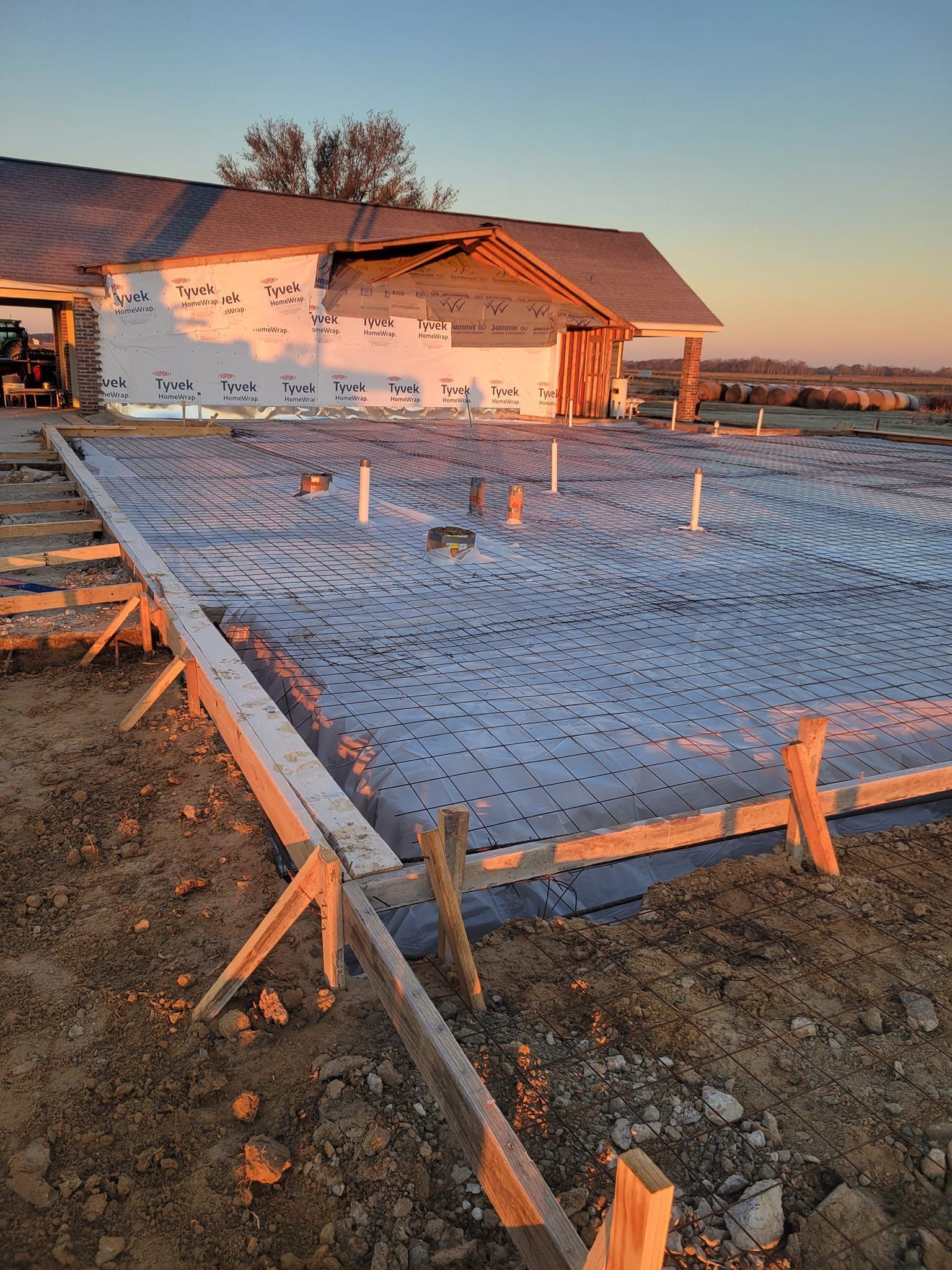 A house is being built on a concrete foundation.