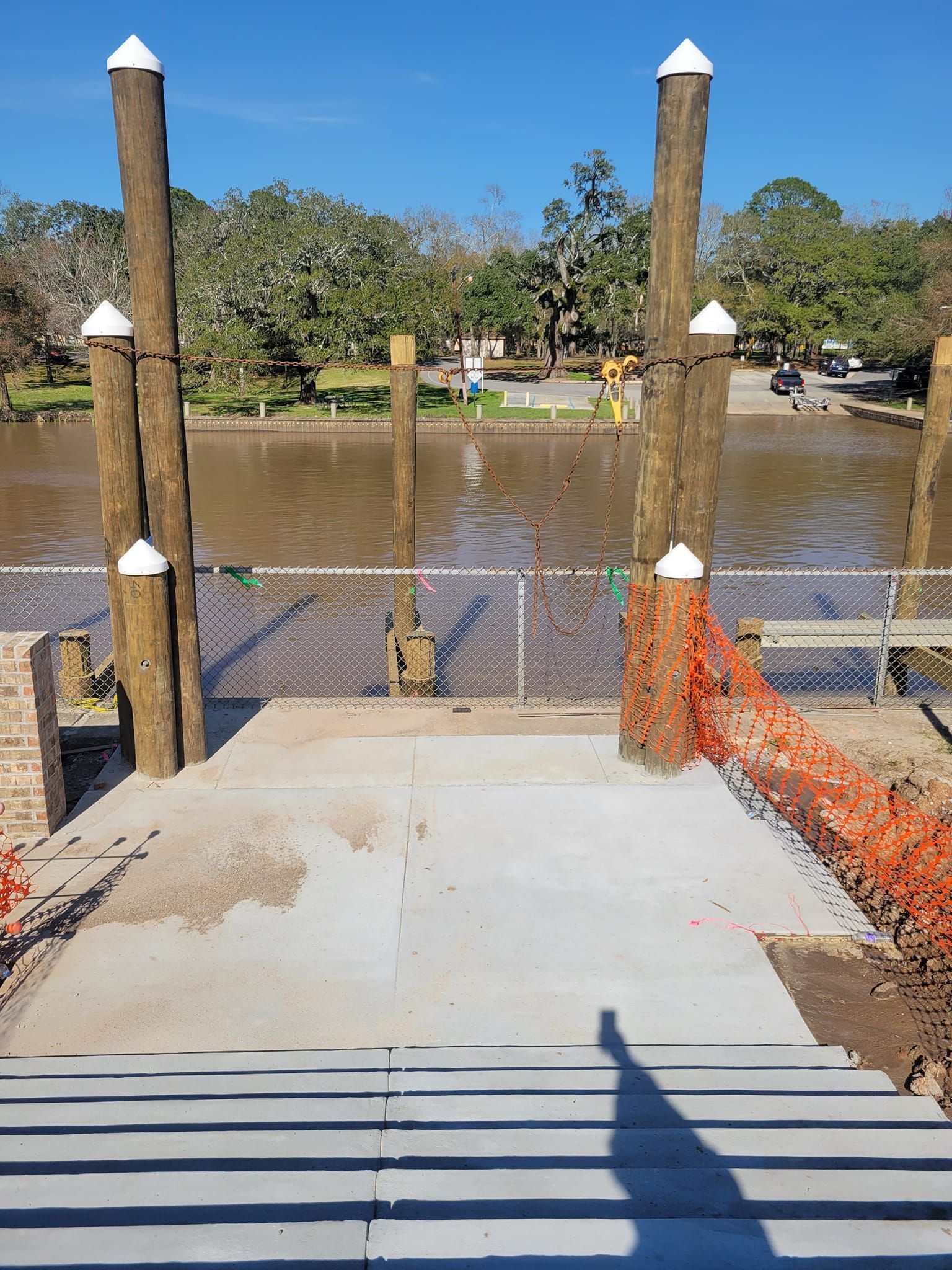 A dock is being built next to a body of water.