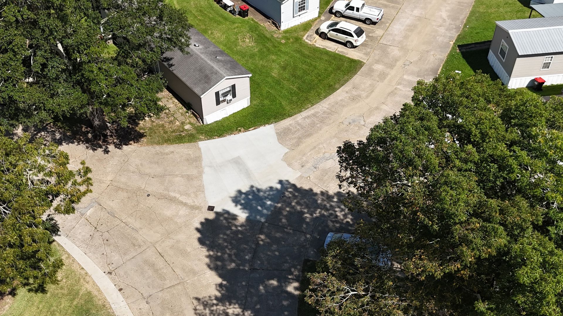 An aerial view of a small town with a lot of houses and trees.