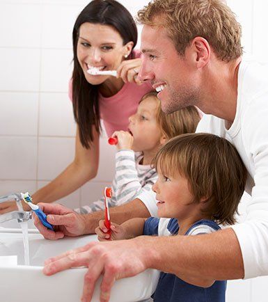 family brushing teeth - Rochester Family Dentistry