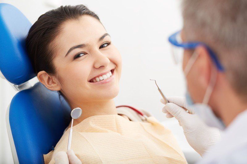 woman smiling in dentists chair