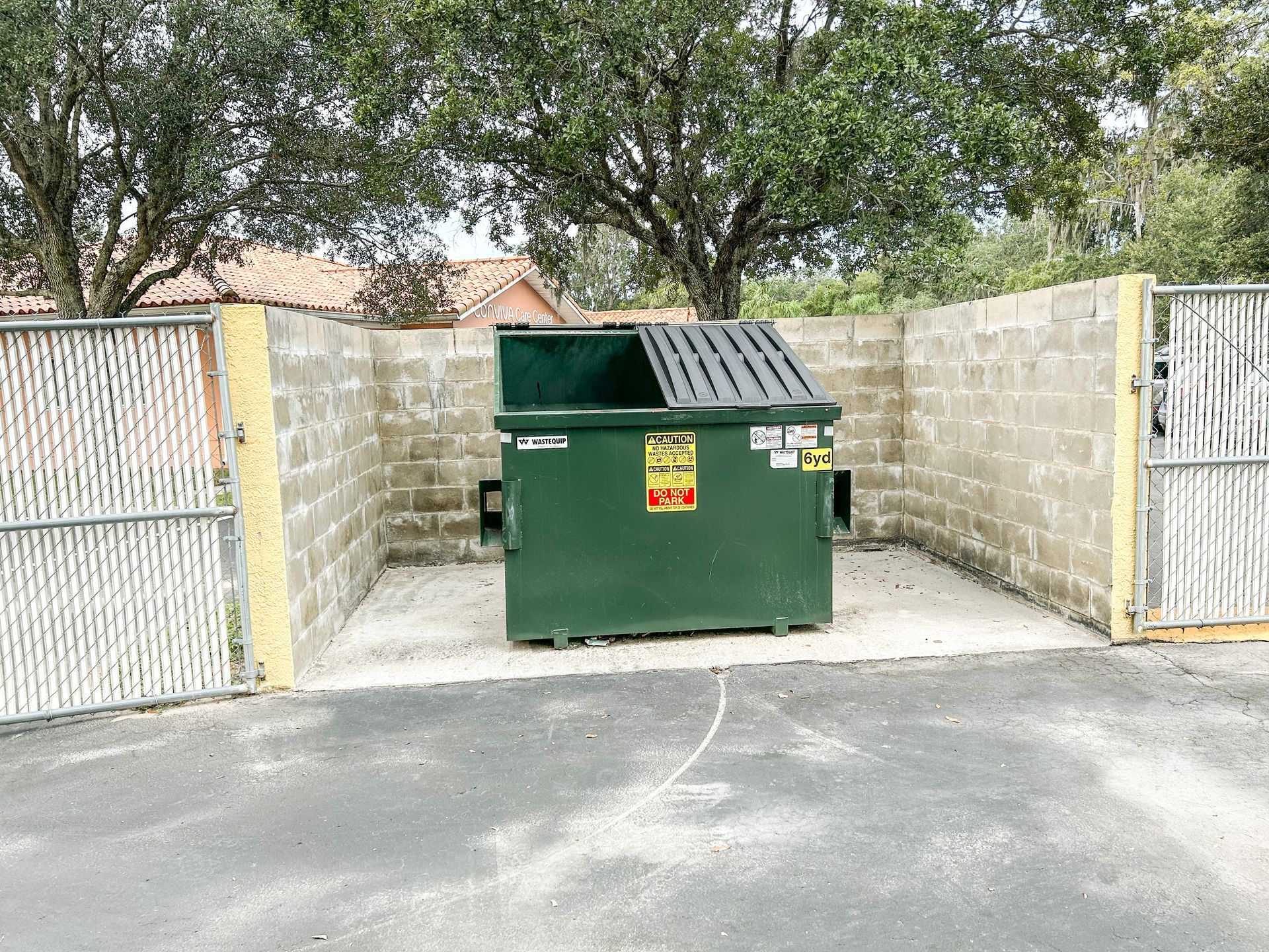 pressure-wash dumpster area in Wesley Chapel