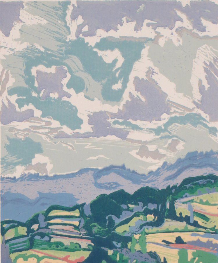 A colorful landscape with a cloudy sky