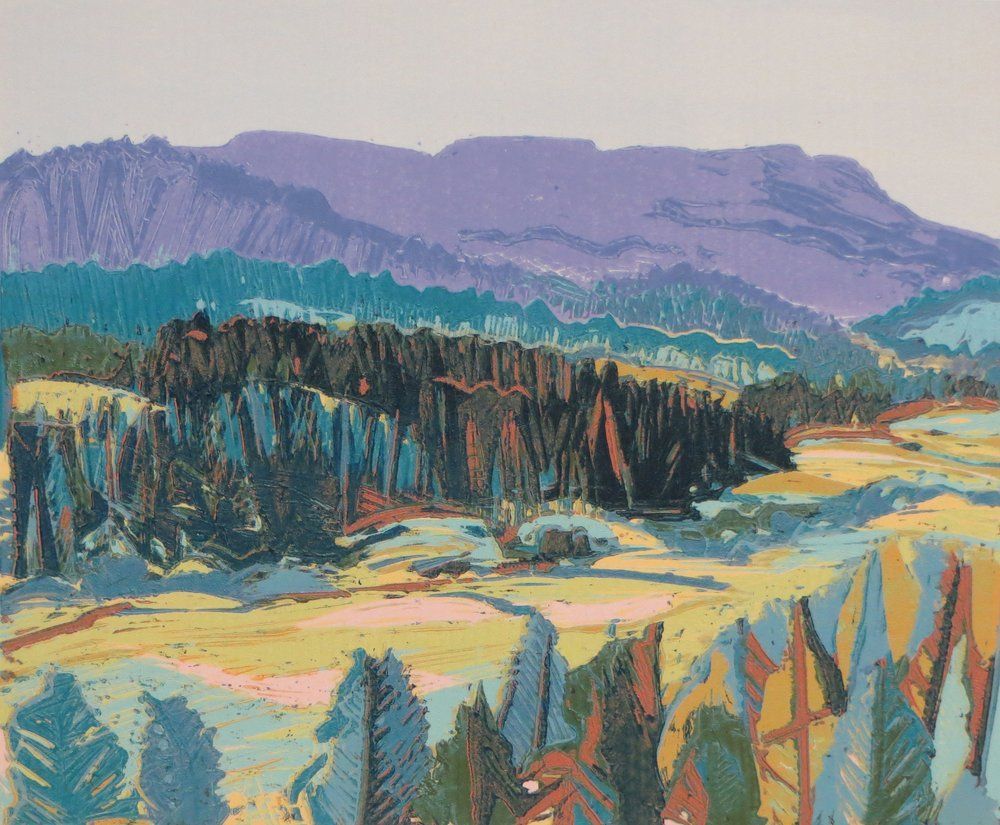 Landscape painting with a purple mountain range and colorful trees in a field