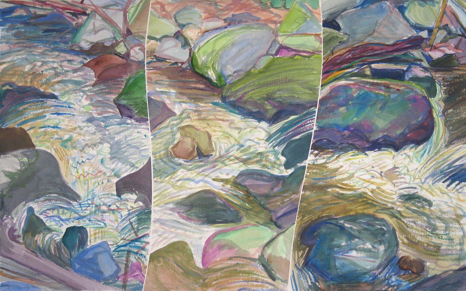 Close-up view of a flowing stream with colorful rocks