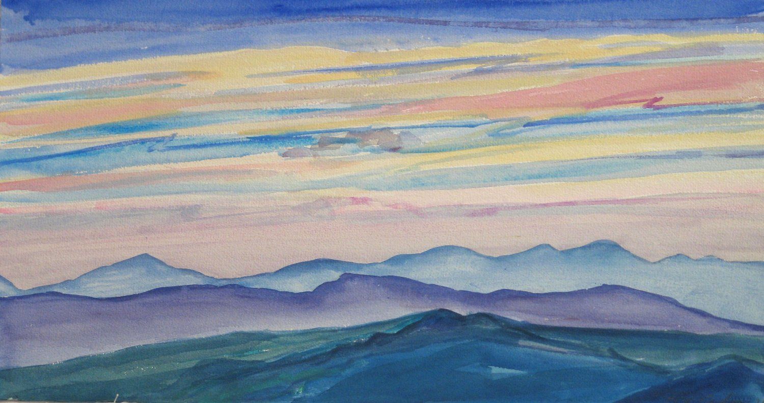 Watercolor of layered blue mountains beneath a colorful, striped sunset sky