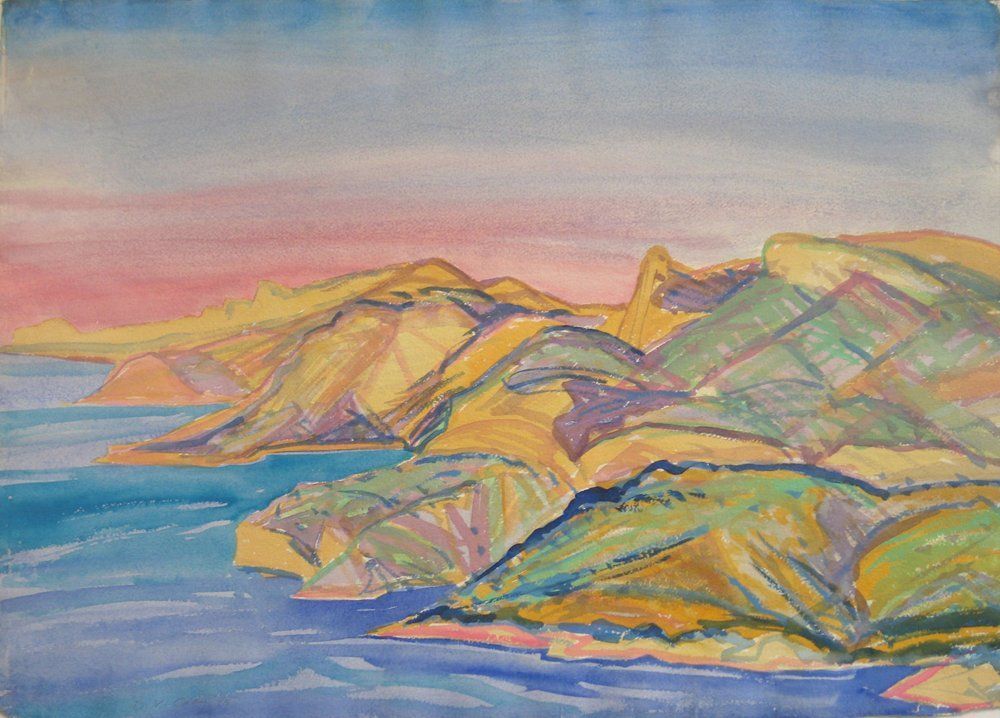 Coastal landscape with colorful hills and sea under a pink and blue sky