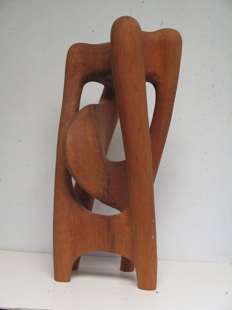 Abstract wooden sculpture with curved and rectangular shapes