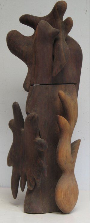 Abstract brown wooden sculpture with organic shapes