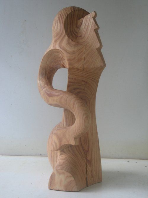 Wooden sculpture of a stylized figure 