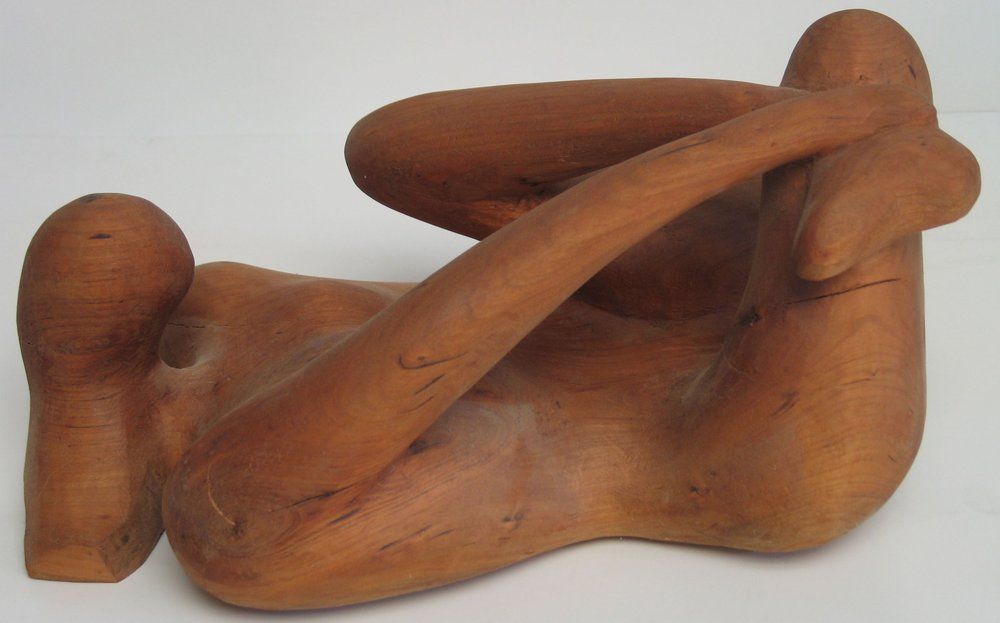 Wooden sculpture of a reclining figure