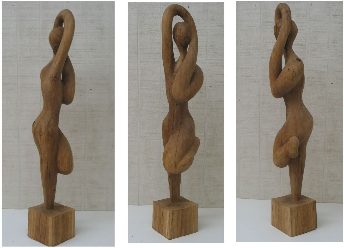 Wooden sculpture of a stylized woman 