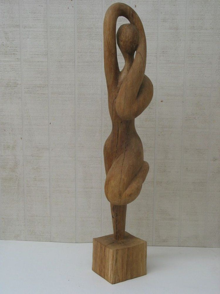 Wooden sculpture of a nude woman