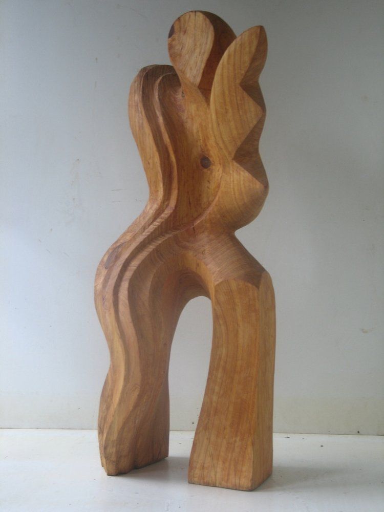Wooden sculpture of a stylized human form