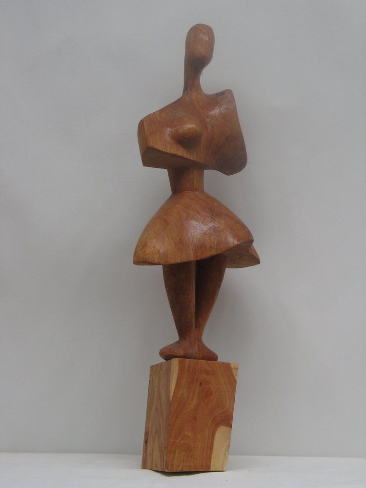 Wooden sculpture of a woman in a dress