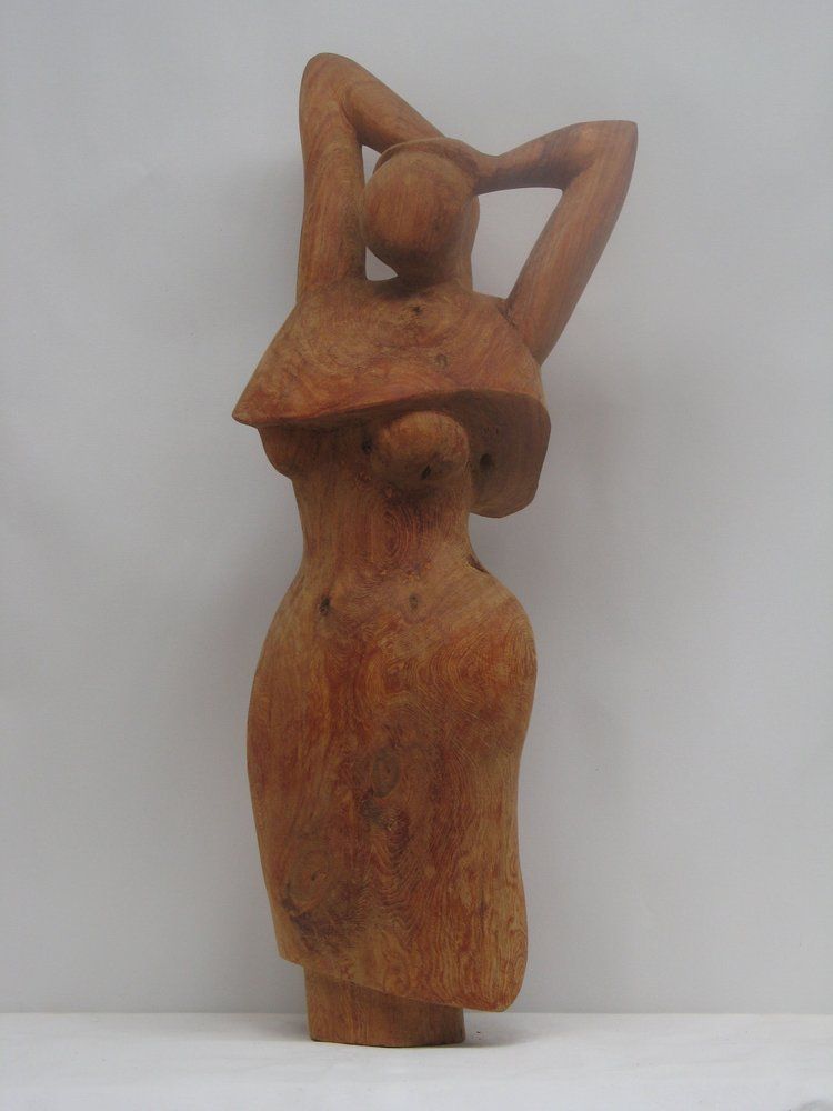 Wooden sculpture of a woman with arms raised behind her head