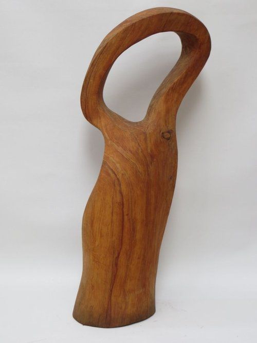 Wooden sculpture of a figure with a curved body