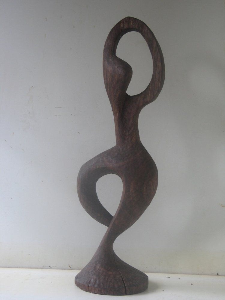 Wooden sculpture of a curved figure 