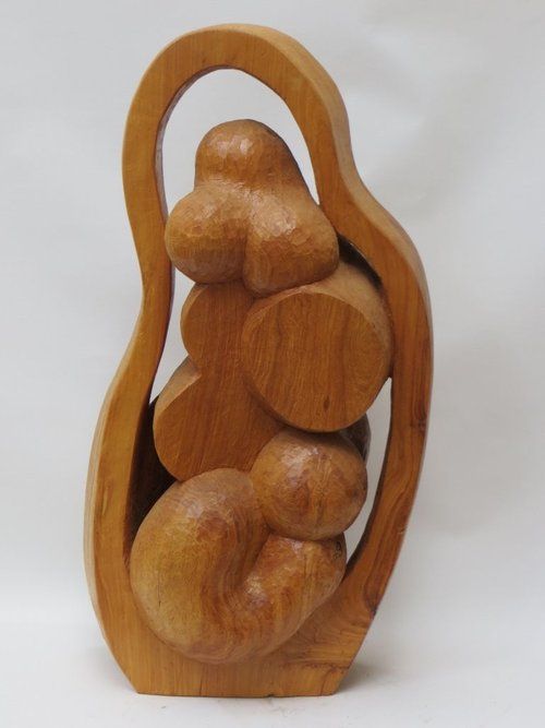 Wooden sculpture of a mother and child