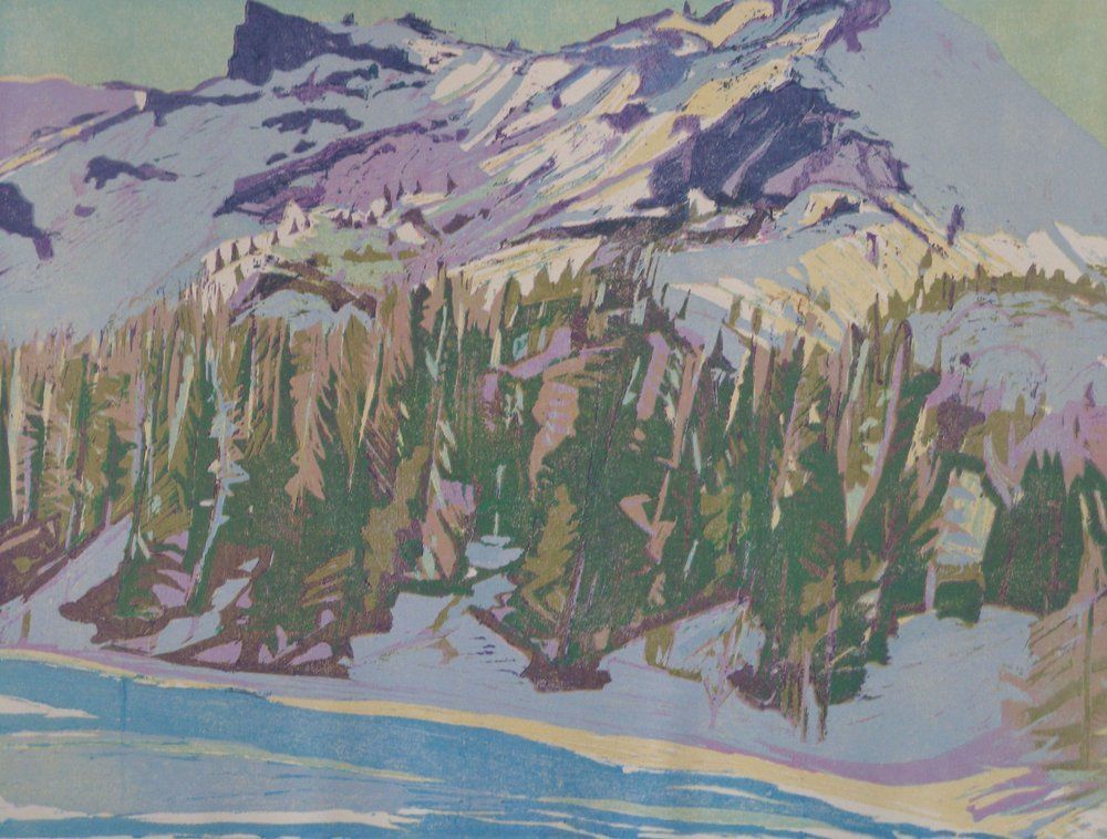 Snowy mountain landscape with fir trees in the foreground