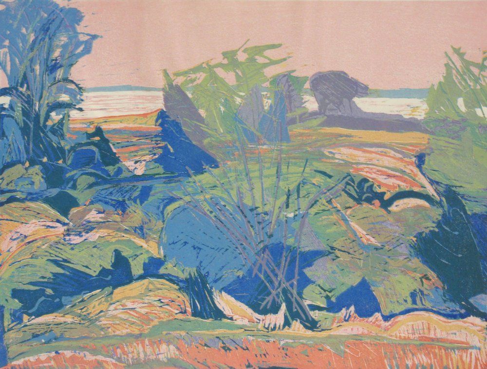 Landscape with blue and green foliage, rocky ground, and a pink sky over water