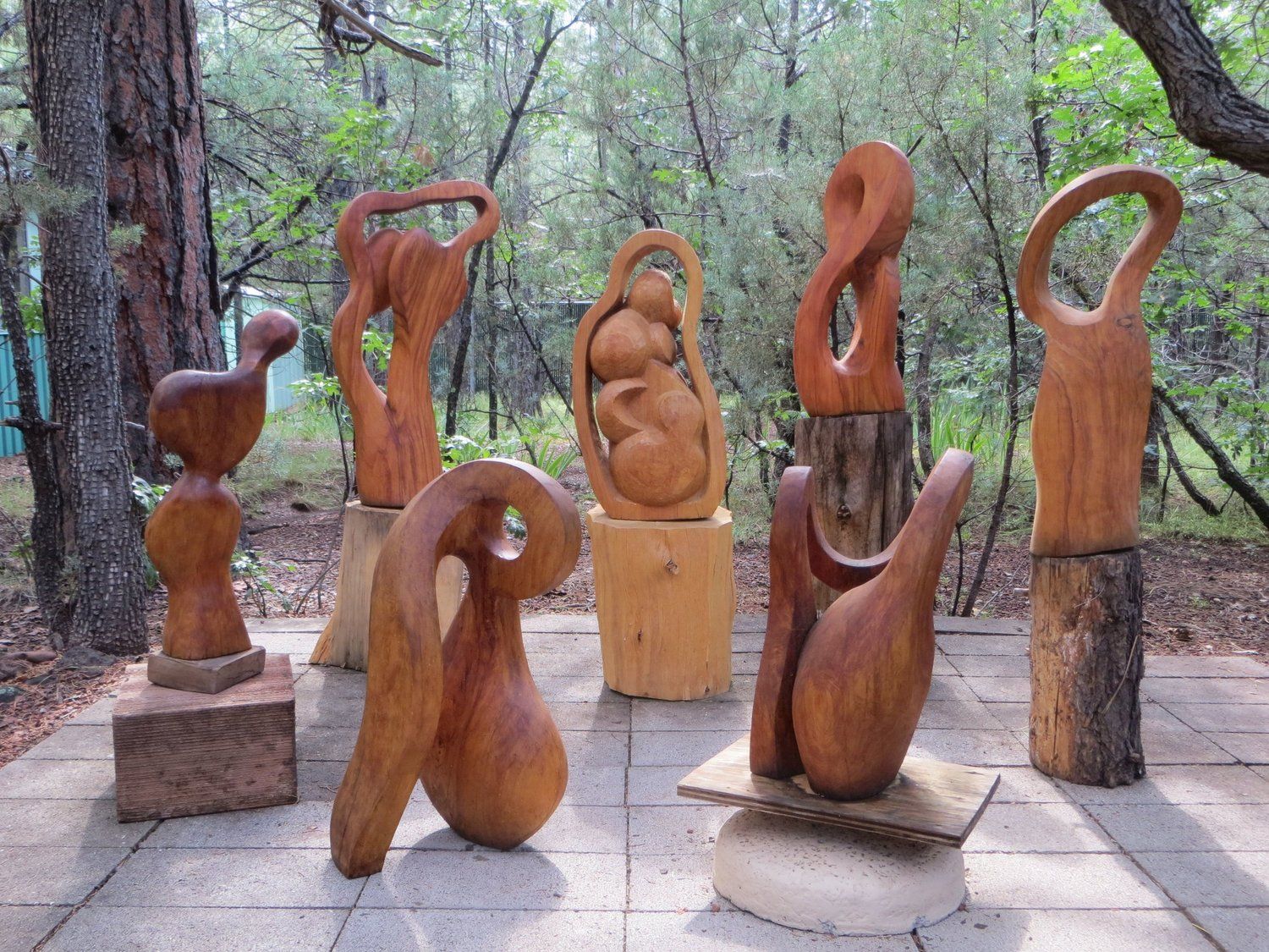 Wooden sculptures displayed outdoors