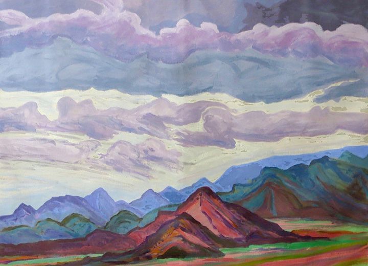 Mountains and colorful clouds dominate the landscape