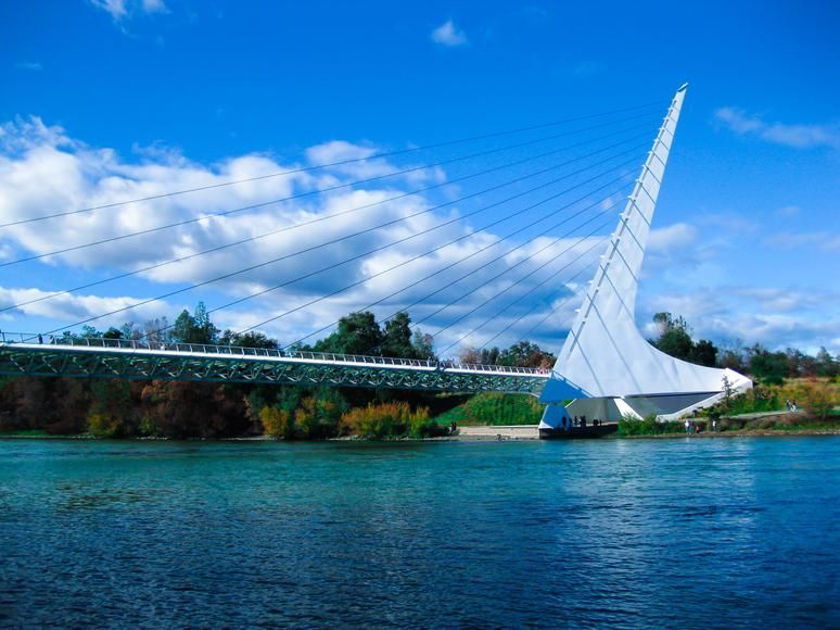 A close up of a plate of food with beans and tacos on a table.