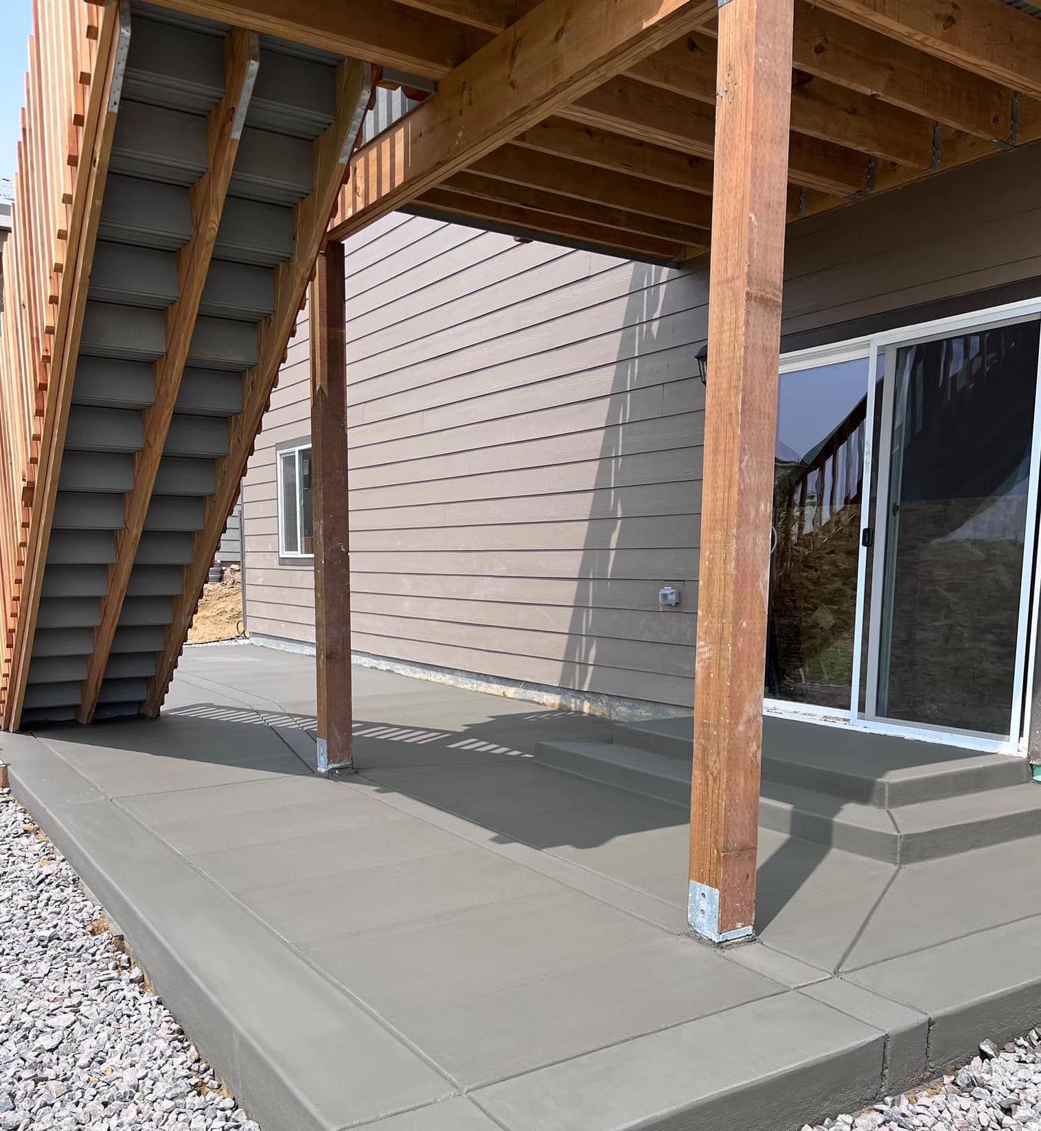 A wooden deck with stairs leading up to it