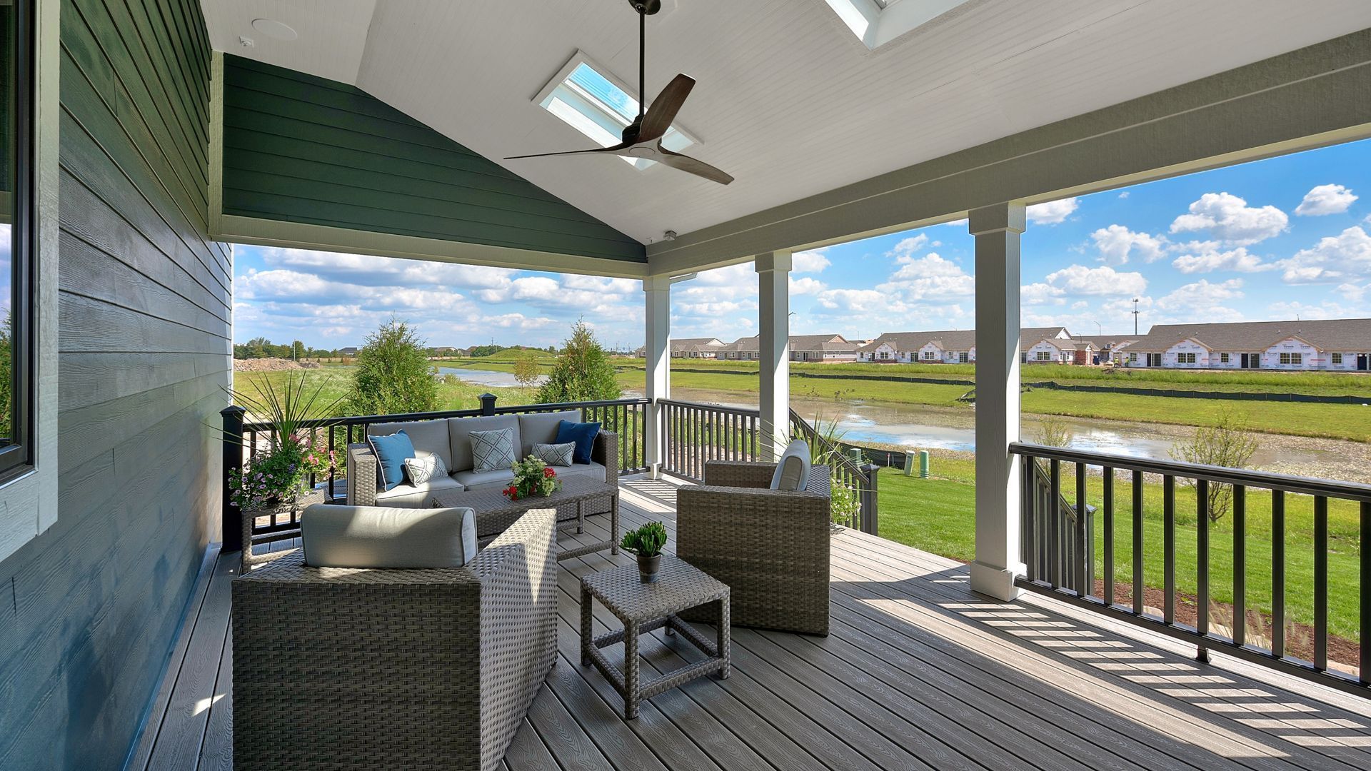 Patio with seating overlooking a serene neighborhood pond in Lexington, KY.