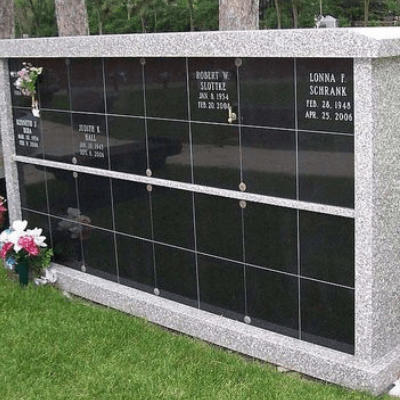 An urn placed in front of a columbarium