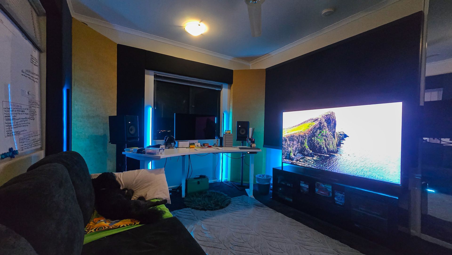 A man is sitting in a boat taking a picture with a camera