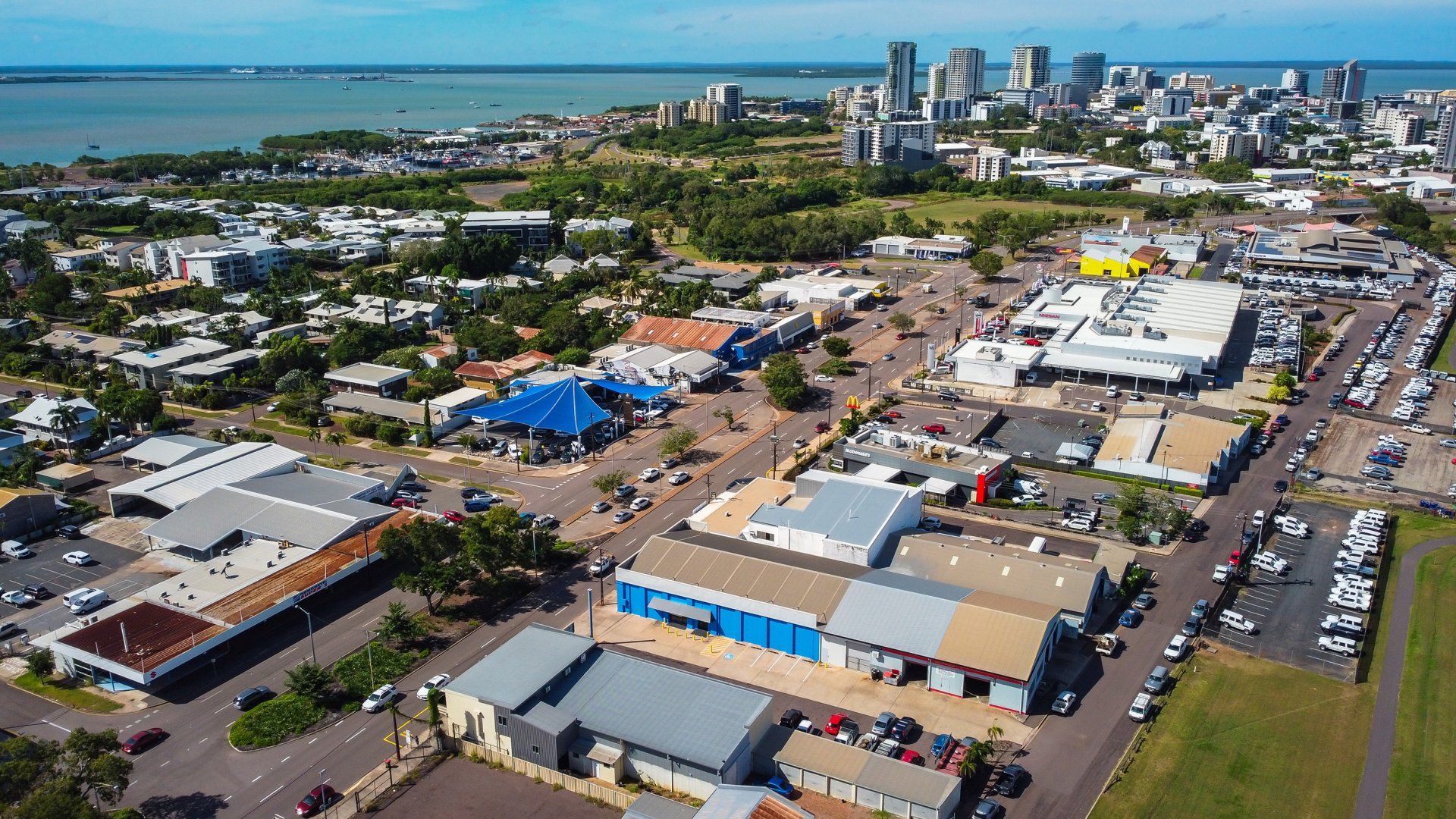 An aerial view of a city with a lot of buildings and trees.