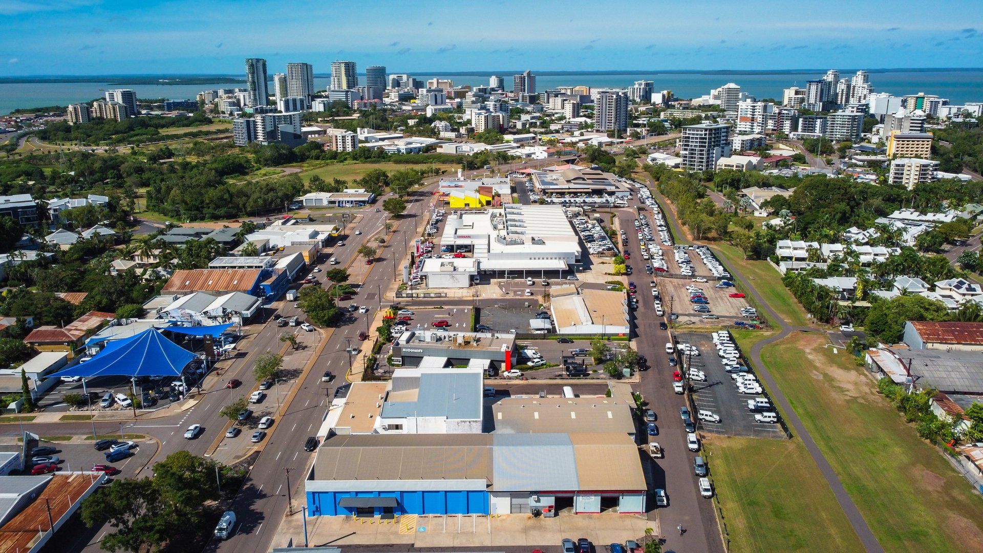 An aerial view of a city with a lot of buildings and trees.