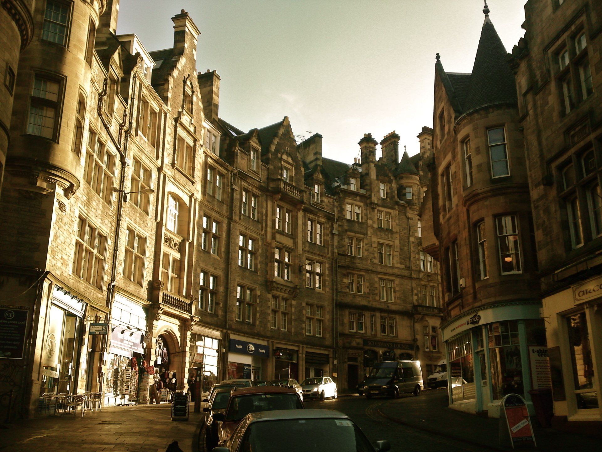 A city street with a lot of buildings and cars