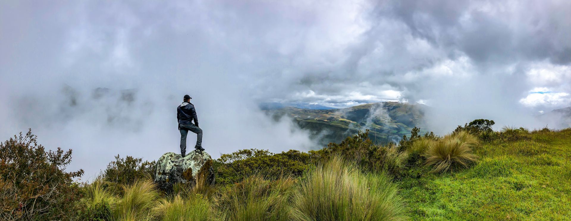 A living room with a circular ceiling and a couch.