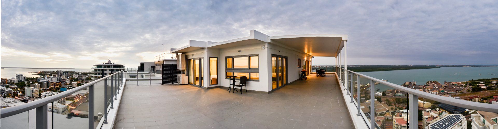 There is a balcony with a view of the ocean.