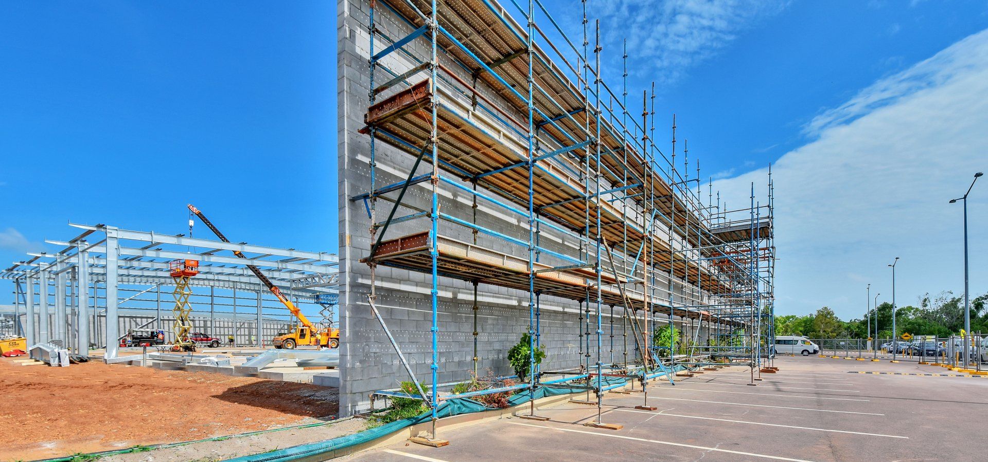 A large building is being built with scaffolding around it.