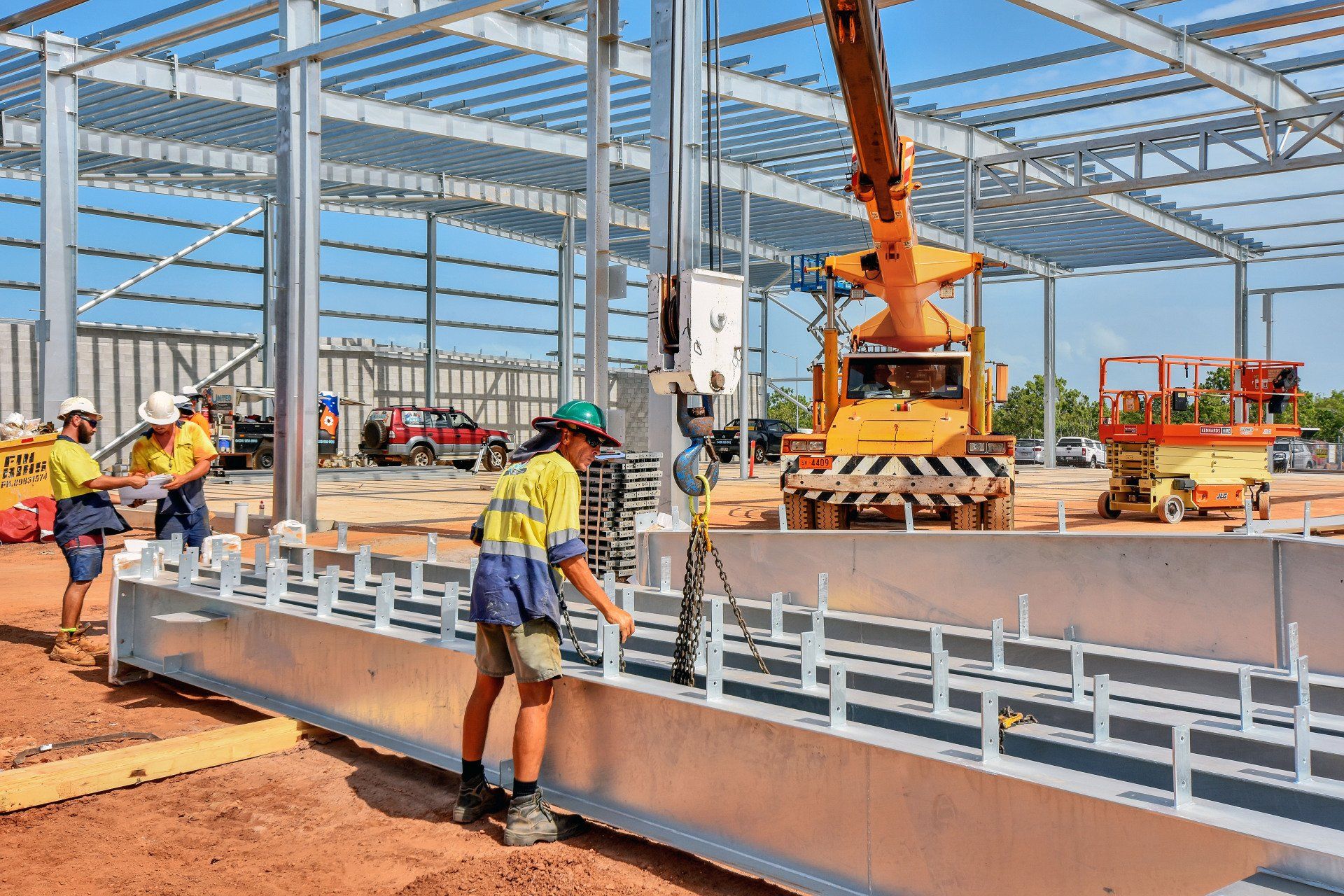 A group of construction workers are working on a building under construction.